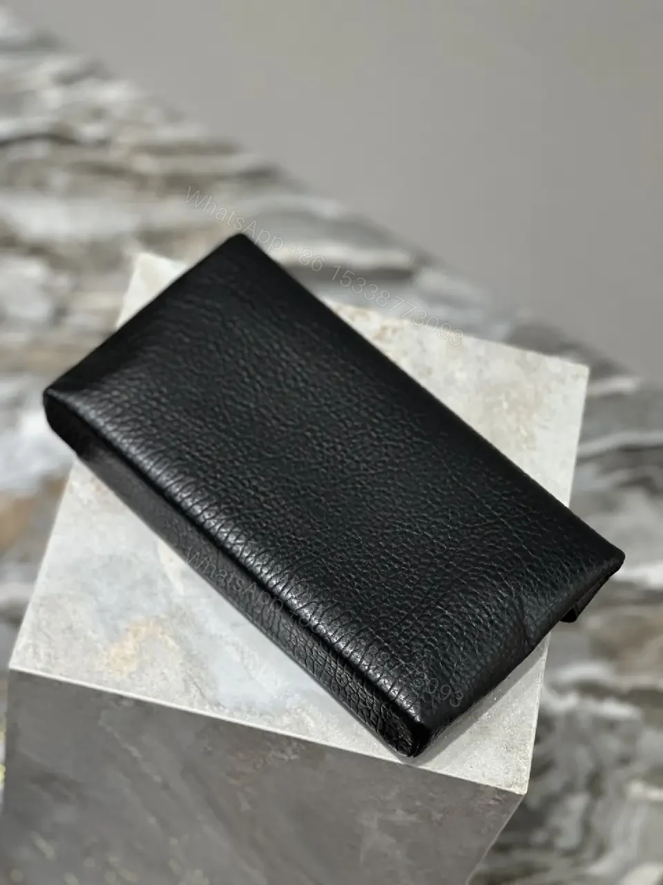 View 7 of Compact Black Leather Envelope Bag with Gold Logo
