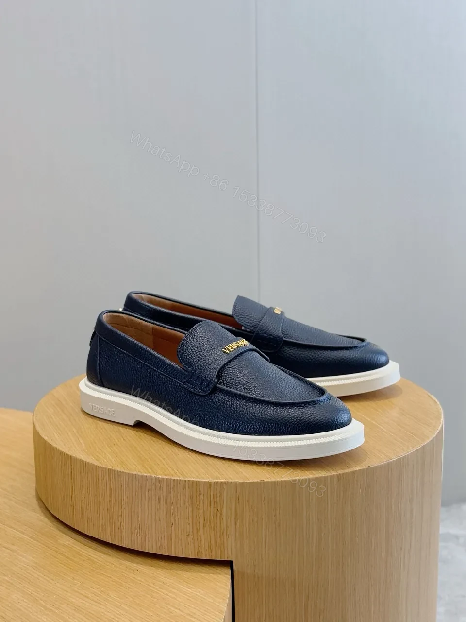 View 7 of Navy Leather Slip-On Loafers with Gold Branding