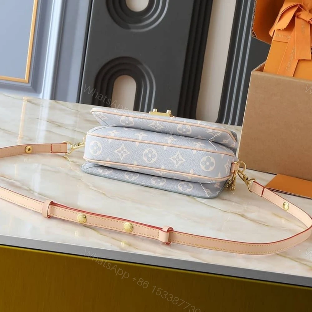 View 5 of Louis Vuitton Pochette Métis East West Coated Canvas Trianon 21Cm M12429
