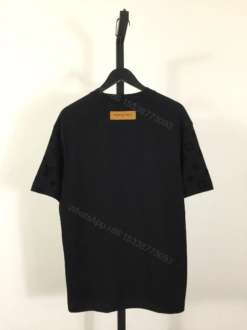 View 2 of Oversized Black Tee with Signature Embellishments — Modern Minimalism