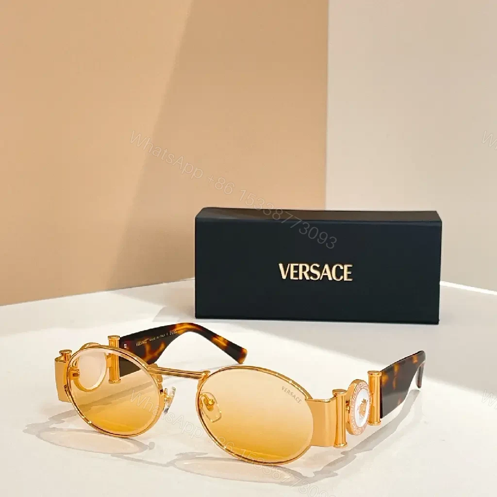 View 8 of Amber-Tinted Round Sunglasses: Gold-Accent, Sculpted Hardware, UV400 Shield