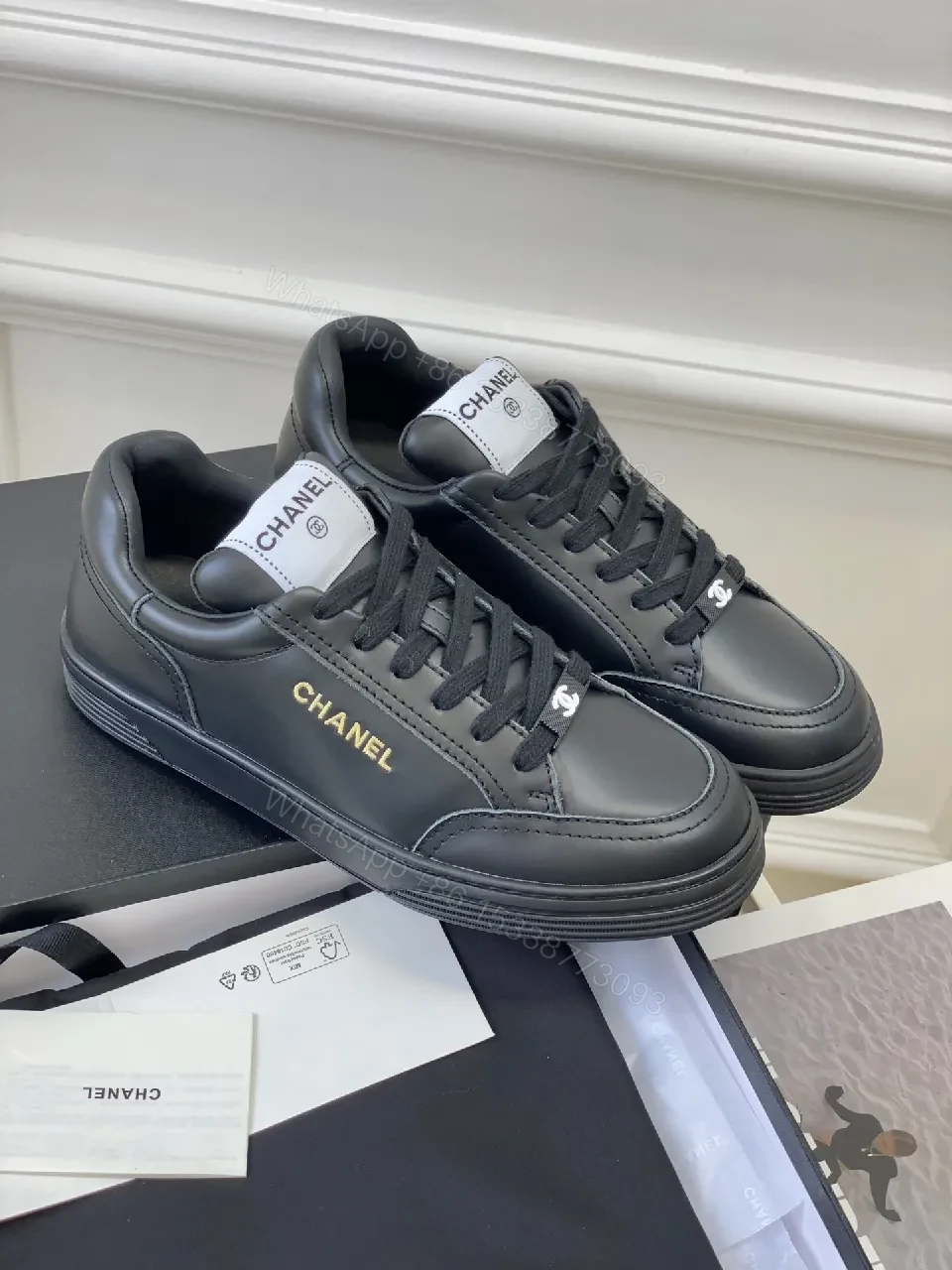 View 2 of Black Leather Sneakers, Subtle Gold Accents, High-Top Style, Everyday Luxury