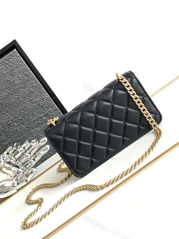 View 2 of Mini Quilted Black Chain Bag with Gold Logo â€” Luxury Silhouette