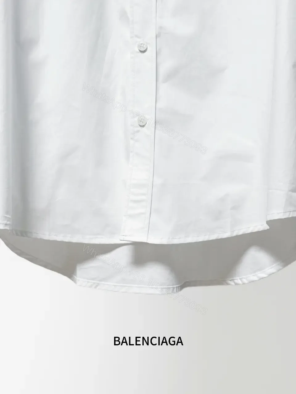 View 4 of Minimalist Button-Front Shirt with Subtle Logo Detail