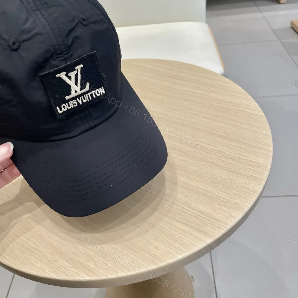 View 6 of Compact Black Cap with Subtle LV Patch, Six-Panel, Adjustable Strap