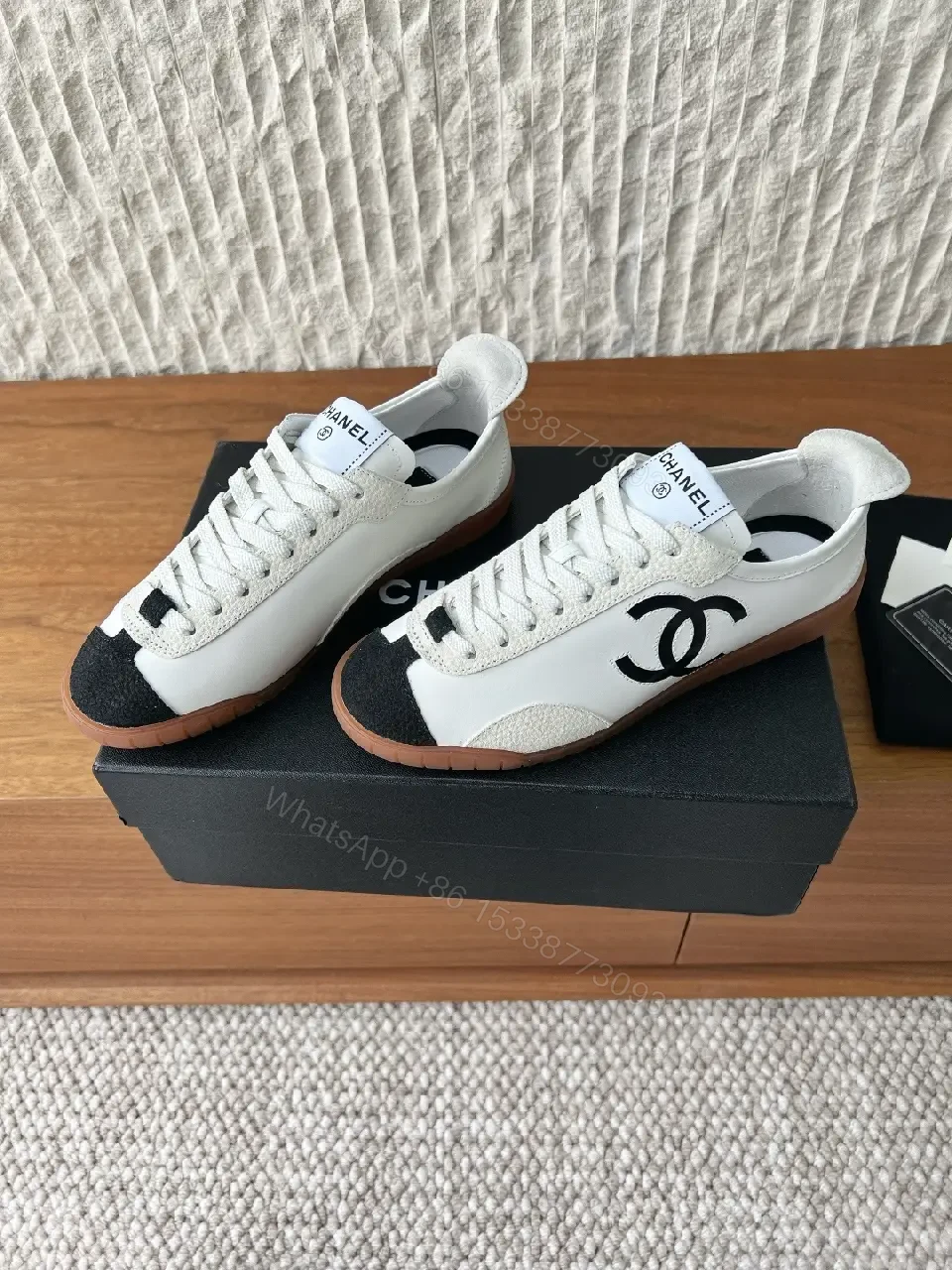 View 3 of Chic Monochrome Leather-Accent Luxury Sneaker, Low-Top