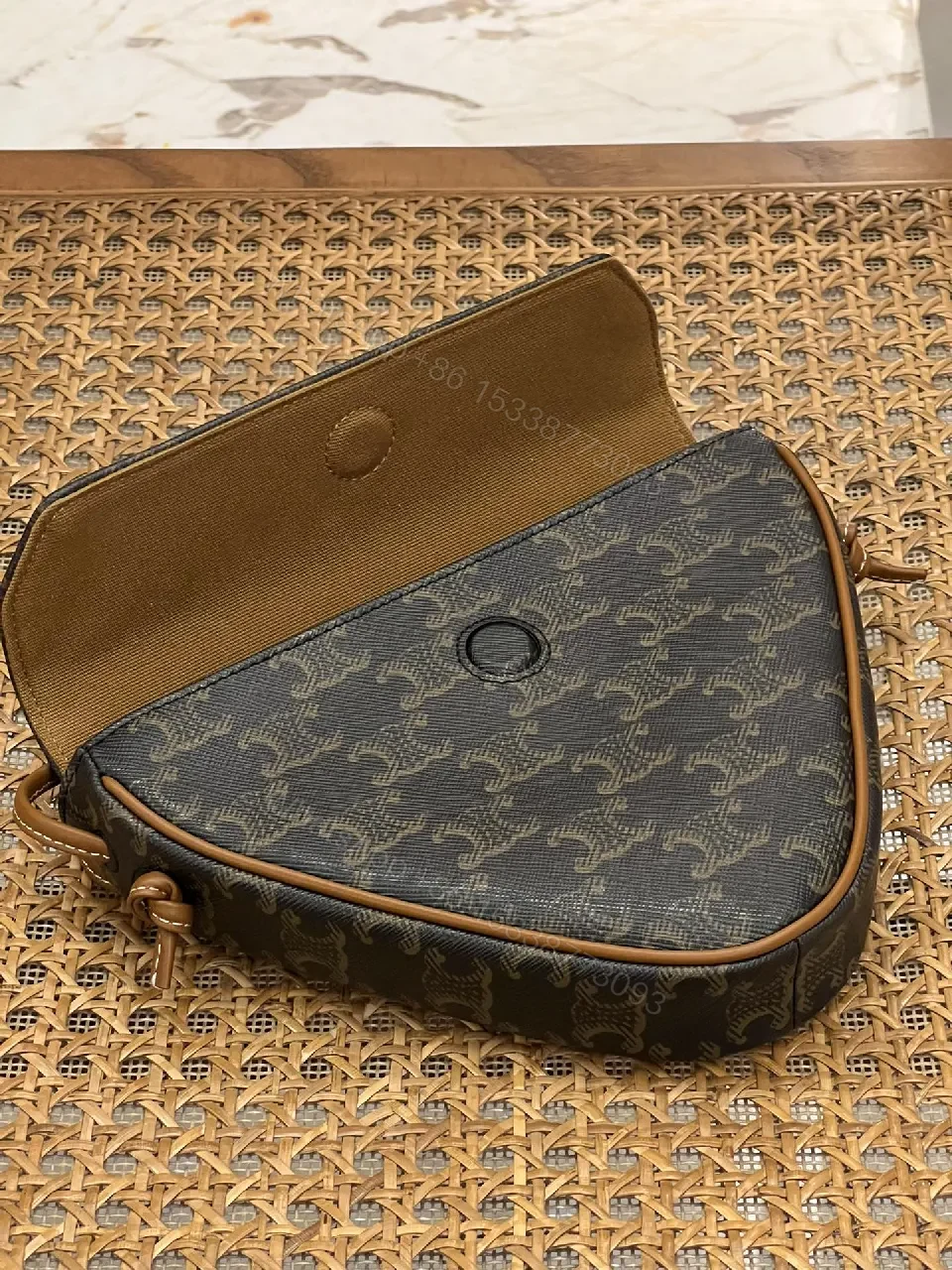 View 2 of Chic Black Monogram Cocoon Bag: Compact Luxury Crossbody