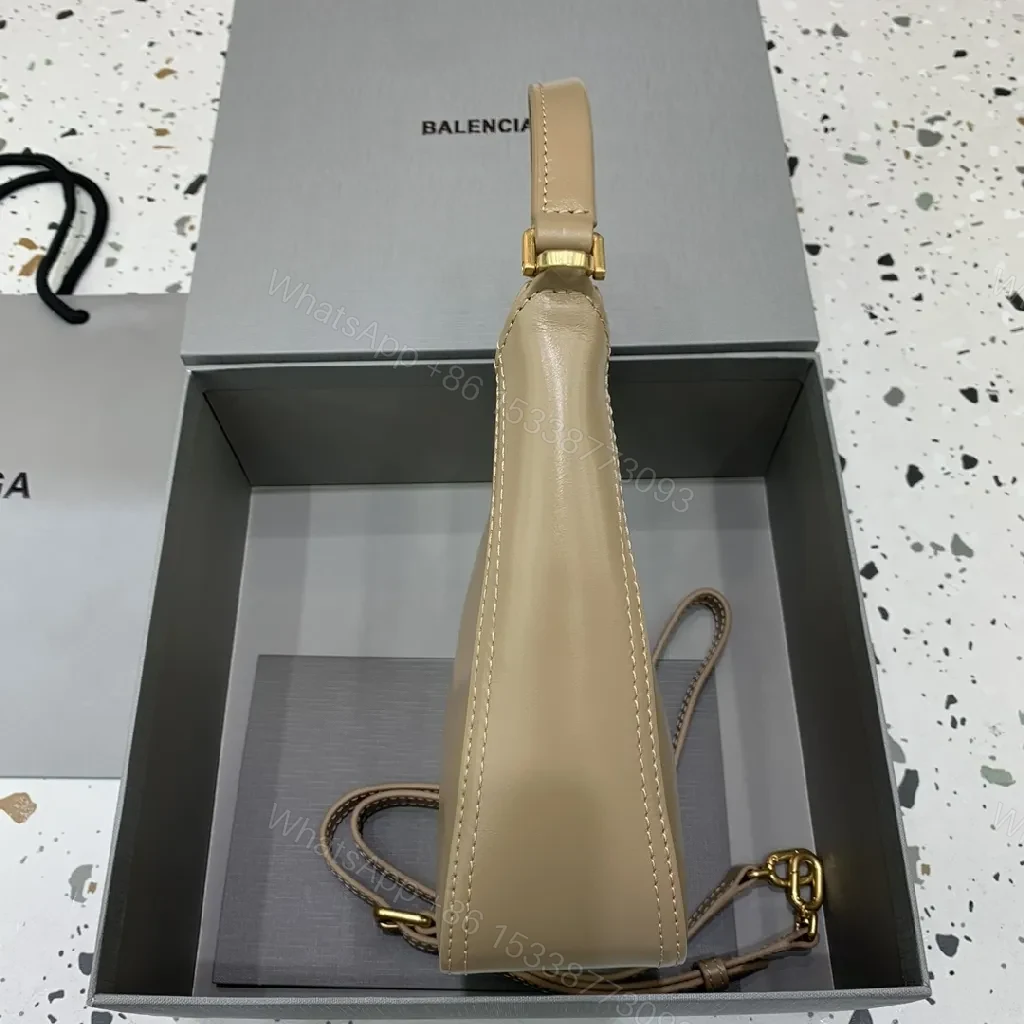 View 2 of Compact Taupe Leather Handbag with Gold Hardware, Crossbody Ready