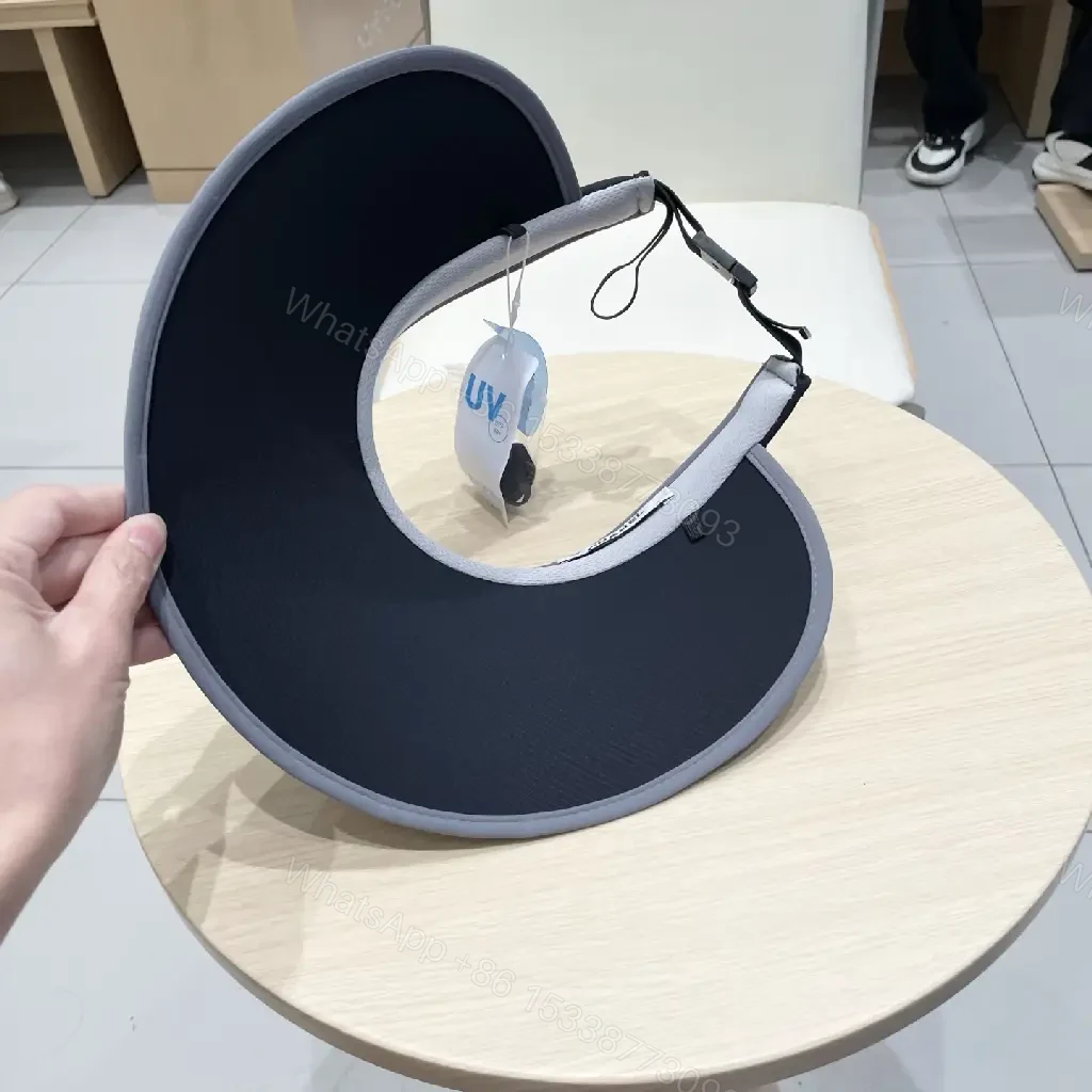 View 3 of Minimalist Black Visor with Chanel-Inspired Detail, UV Shield