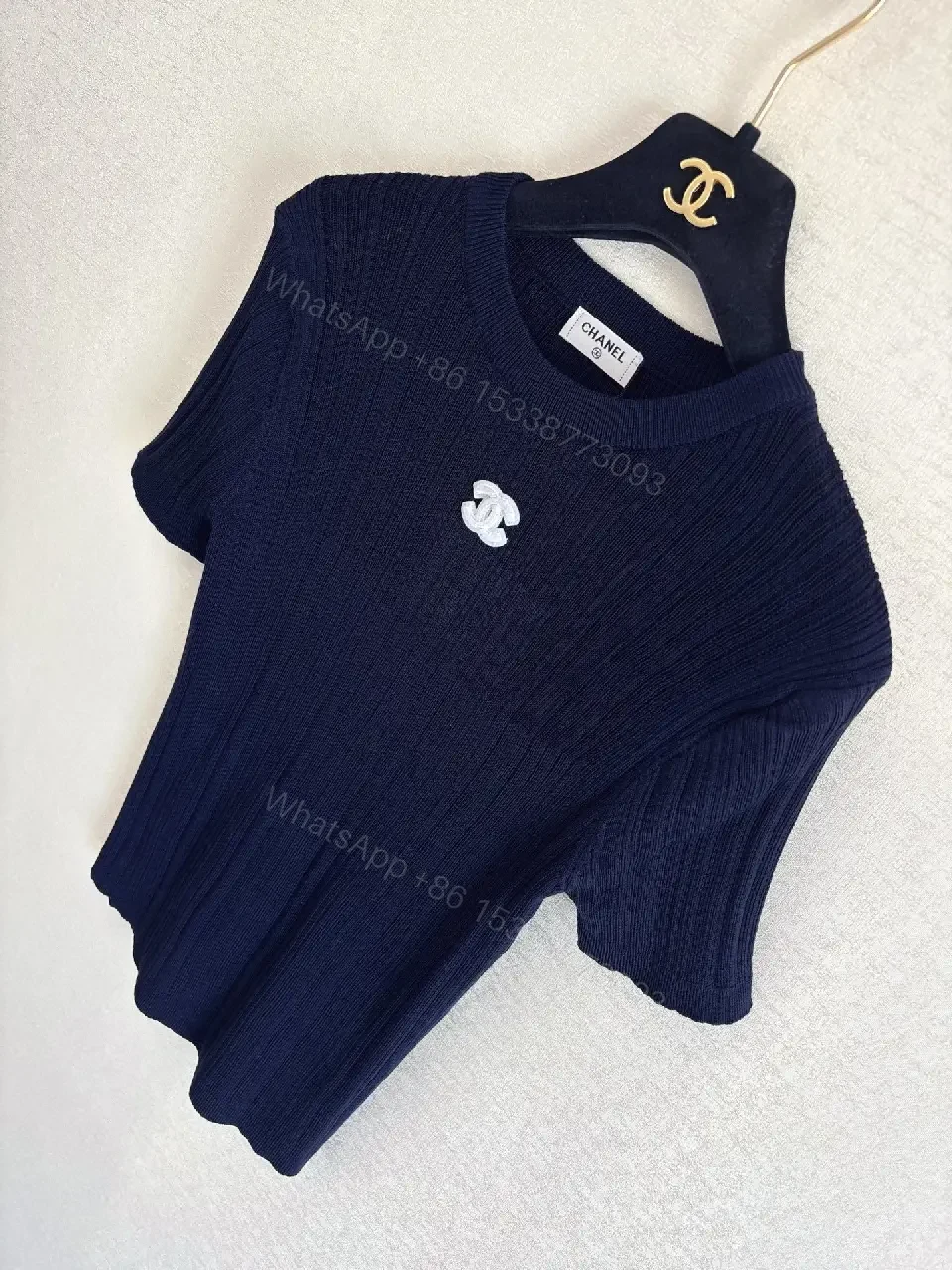 View 6 of Navy Knit Tee: Ribbed Texture, Subtle Crest Emblem, Luxe Casual