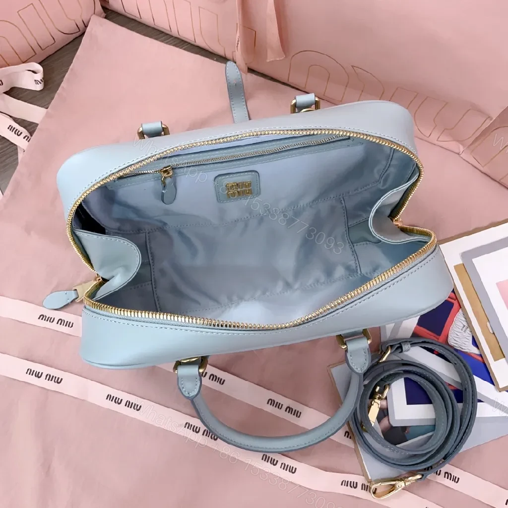 View 7 of Structured Dome Bag: Compact Luxury, Gold Accents, Versatile Style
