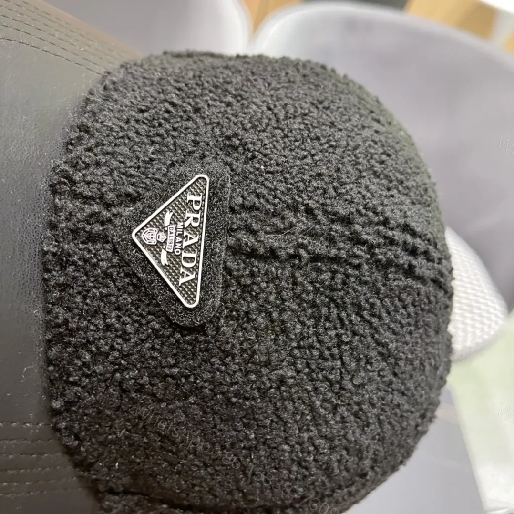 View 5 of Textured Luxury Cap: Fleece Crown, Leather-Like Brim, Minimal Prada Flair