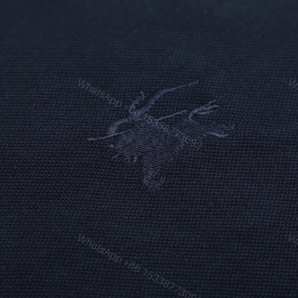 View 4 of Navy Pique Polo: Classic Knit, Luxe Texture, Everyday Style