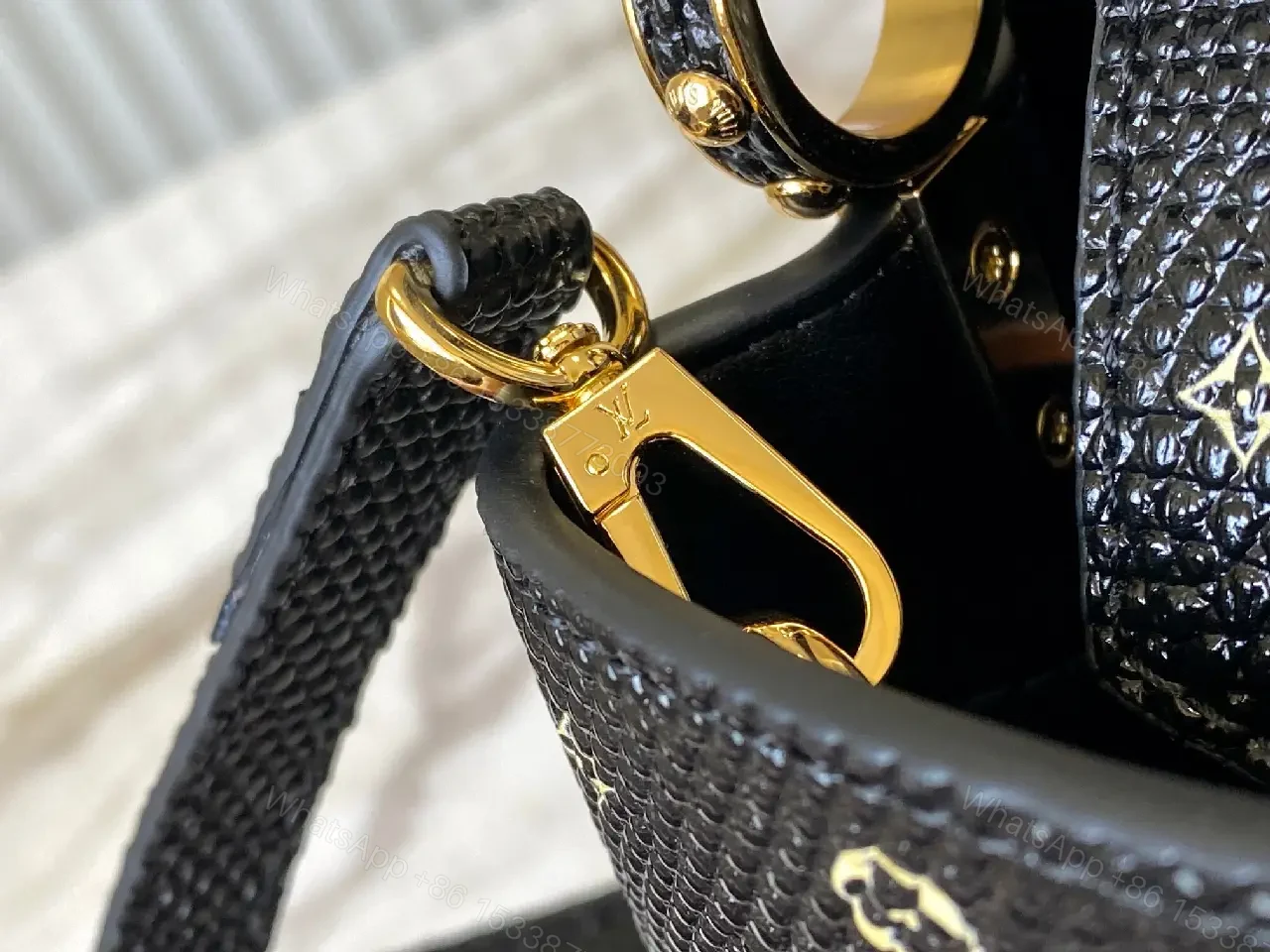 View 2 of Compact Black Pebble-Grain Top-Handle Bag with Gold Hardware