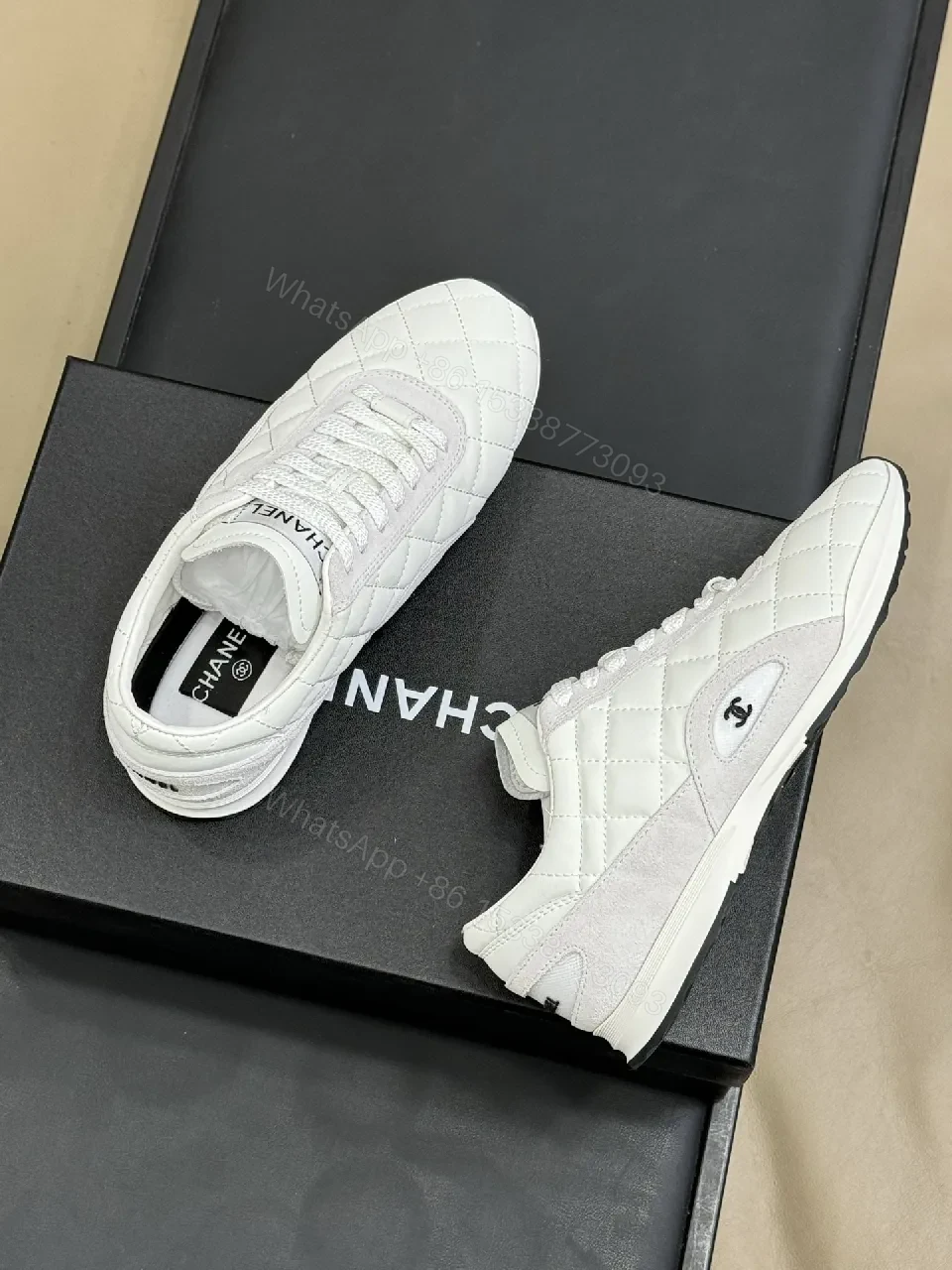 View 2 of White Quilted Leather Low-Top Sneakers with Signature Detailing