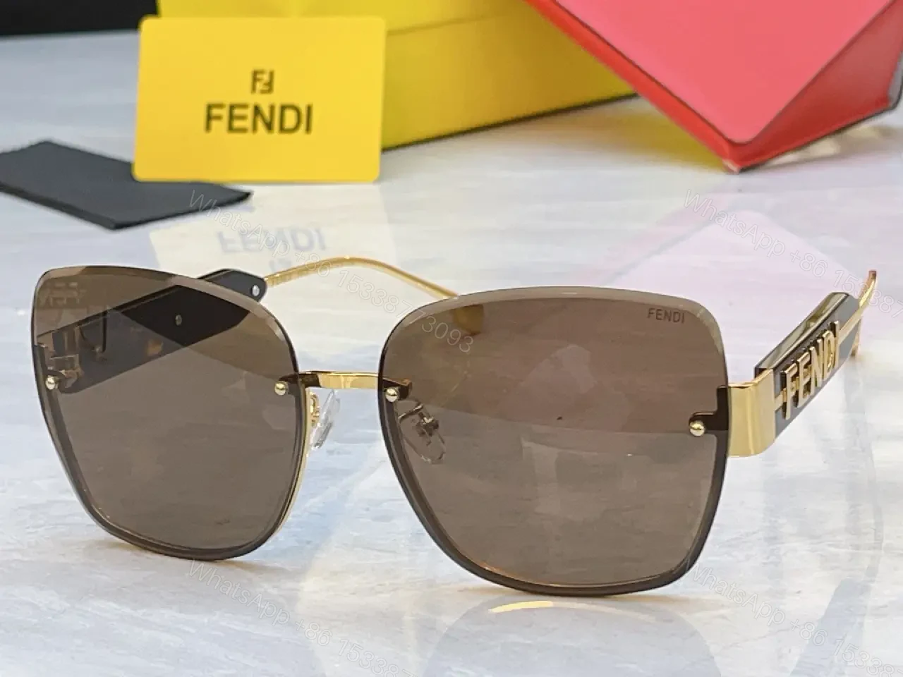 View 4 of Gold Frame Pink Gradient Sunglasses with FENDI Logo