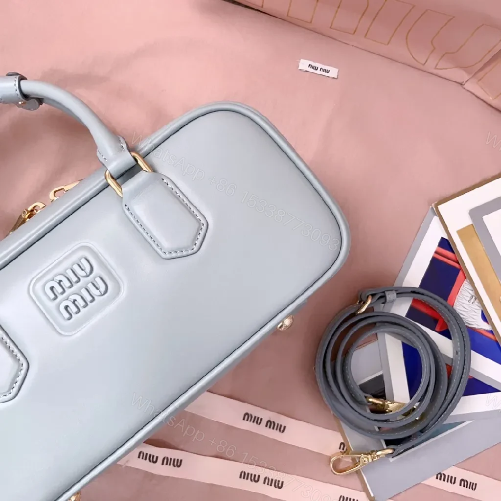 View 4 of Structured Dome Bag: Compact Luxury, Gold Accents, Versatile Style