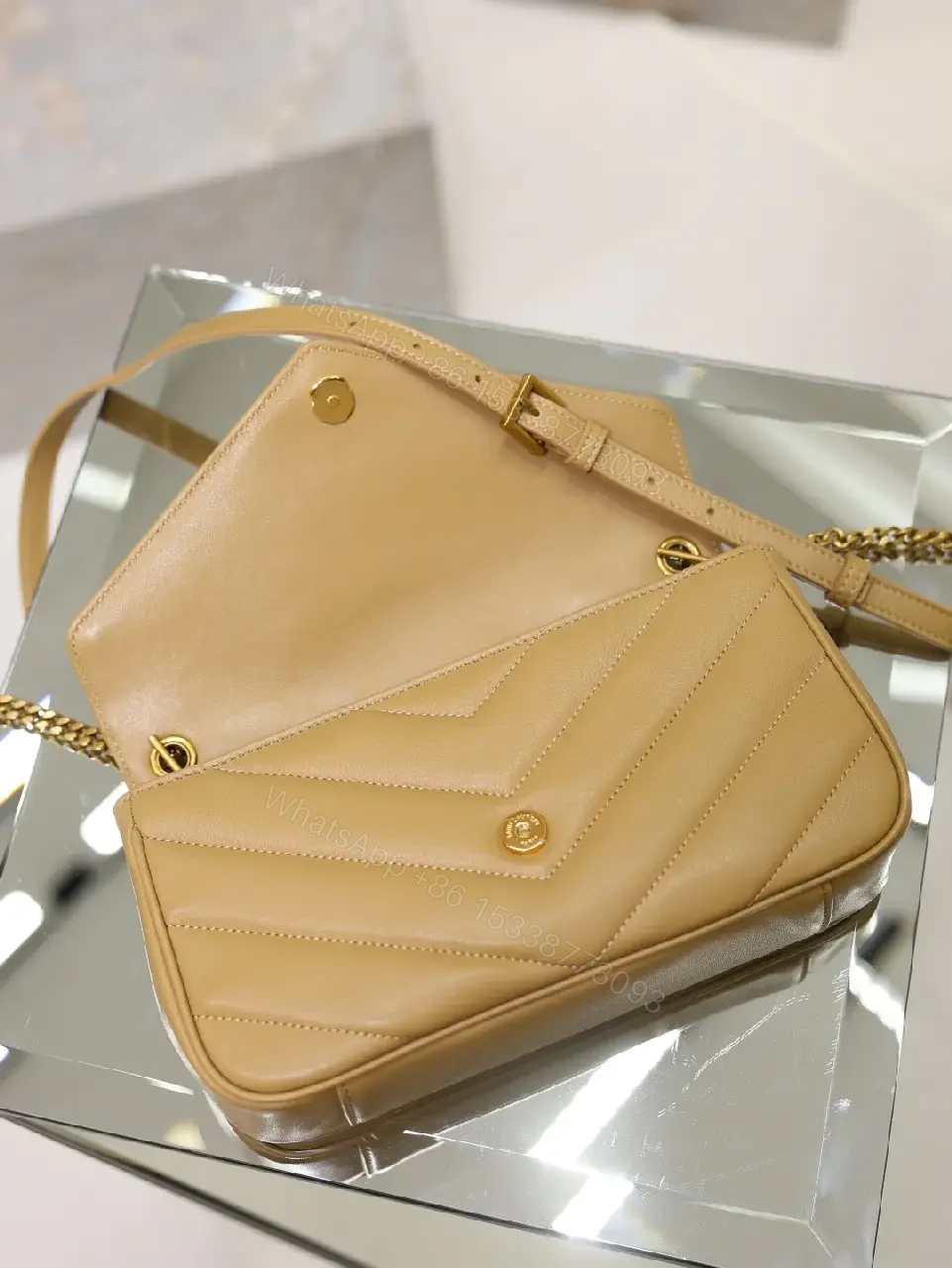 View 5 of Beige Leather Structured Top-Handle Flap Bag with YSL Logo