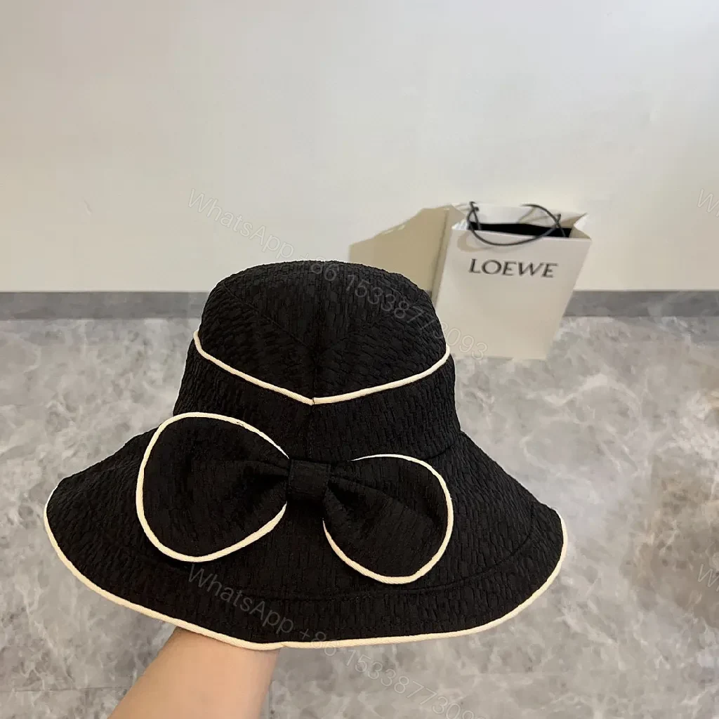View 7 of Structured Black Straw Bucket Hat — Crystal Logo Accent, All-Season Style