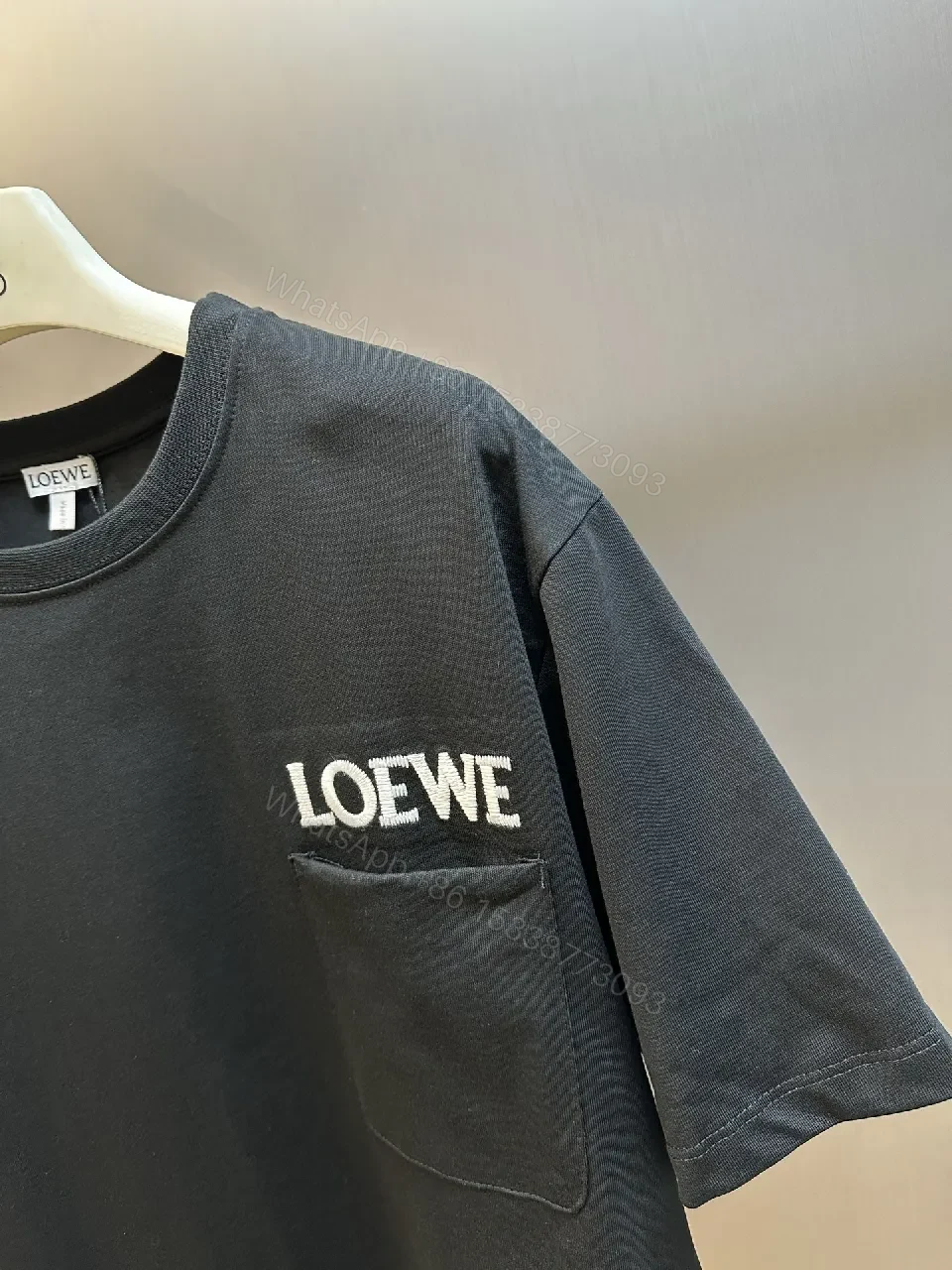 View 9 of Black Minimalist Tee with Chest Pocket - Premium Cotton, Relaxed Fit