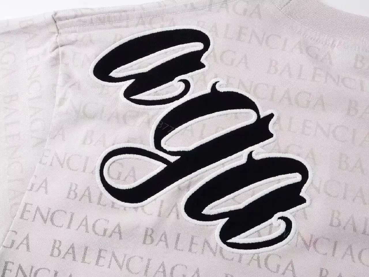 View 3 of Bold Monogram Tee: White Cotton with All-Over Black Script Pattern