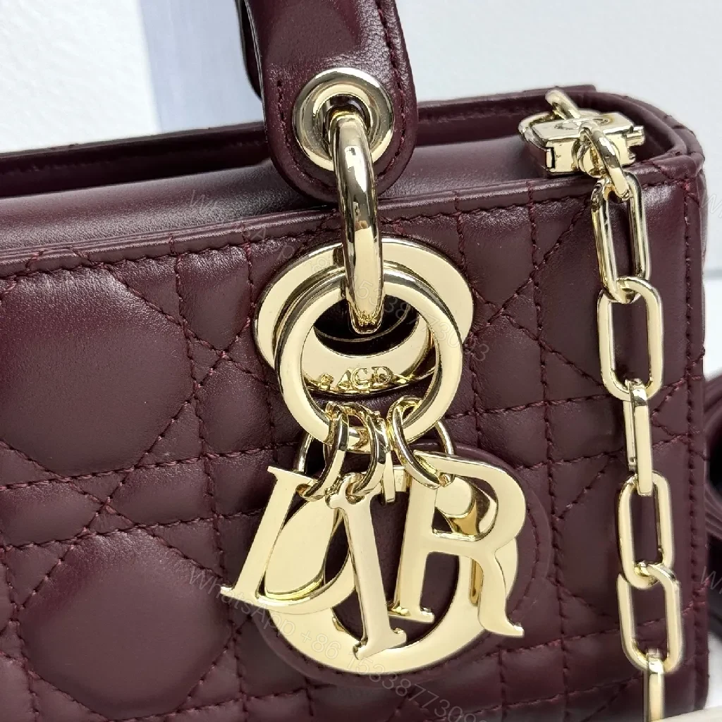 View 4 of Quilted Burgundy Calfskin Top-Handle Bag with Gold Accents