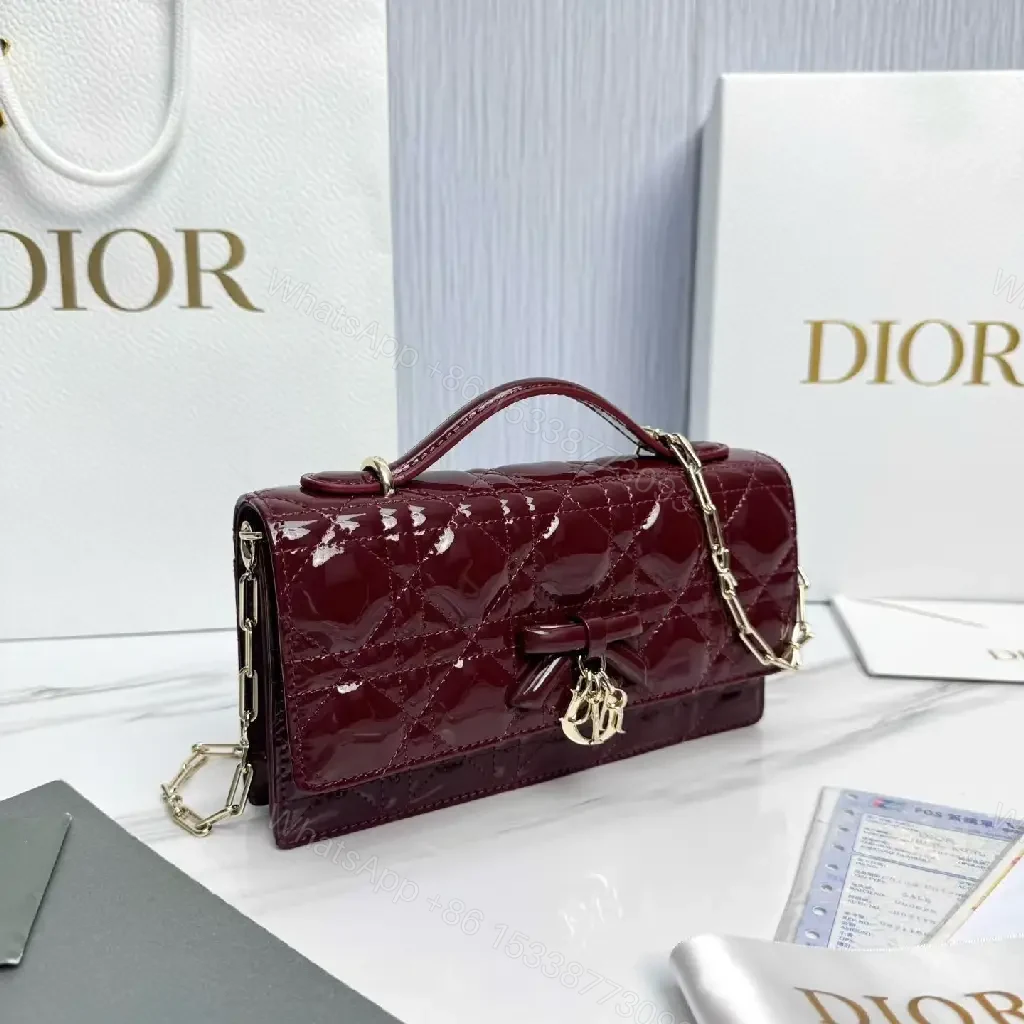 View 9 of Glossy Burgundy Quilted Mini Bag with Bow Accent
