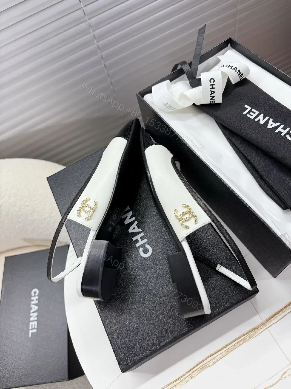 View 6 of Two-Tone Patent Slingback Pumps: Sharp Architectural Elegance