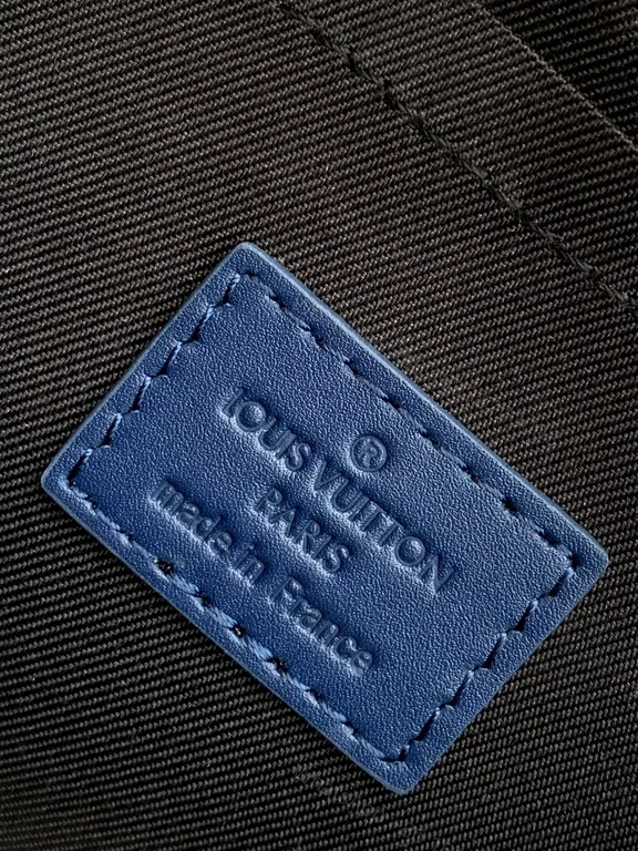 View 6 of Chic Blue Leather Compact Backpack with LV Detail