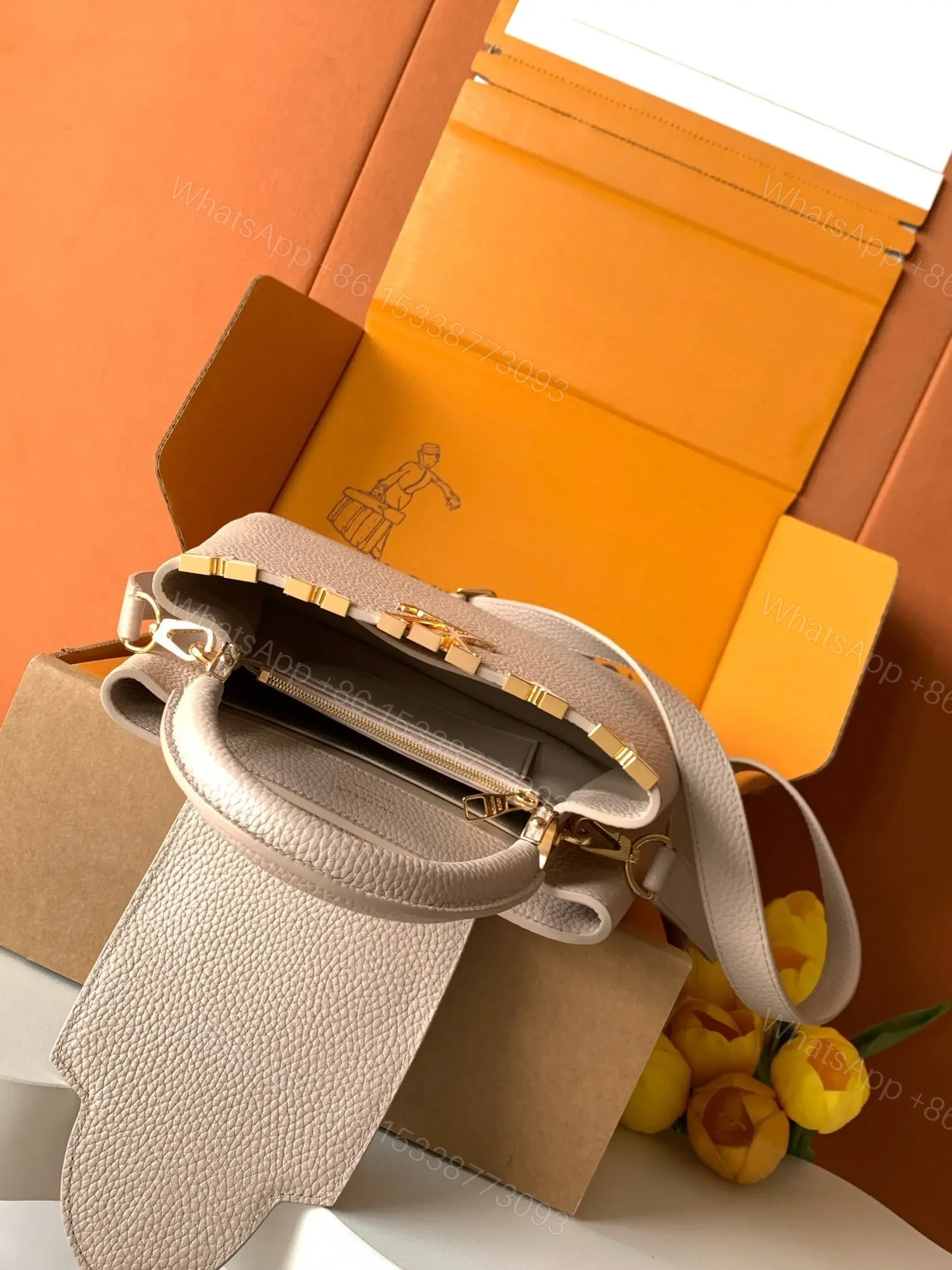 View 3 of Louis Vuitton Capucines handbag in a beige