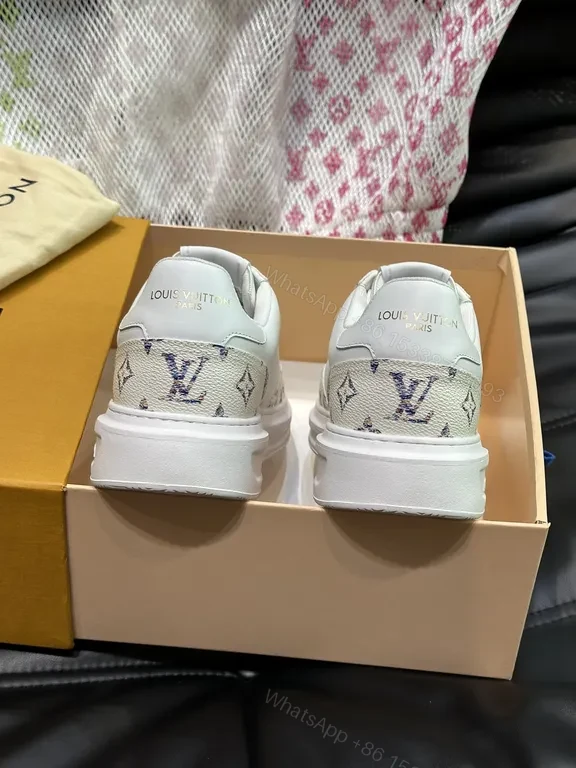 View 2 of Louis Vuitton-Style White Leather Sneakers with Signature Details