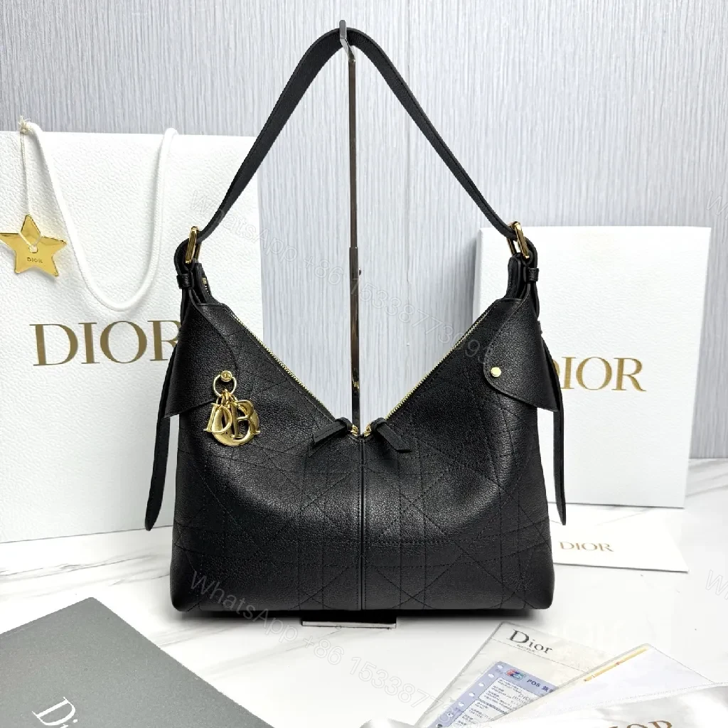 Chic Black Leather Hobo Bag with Gold Charms — view 1