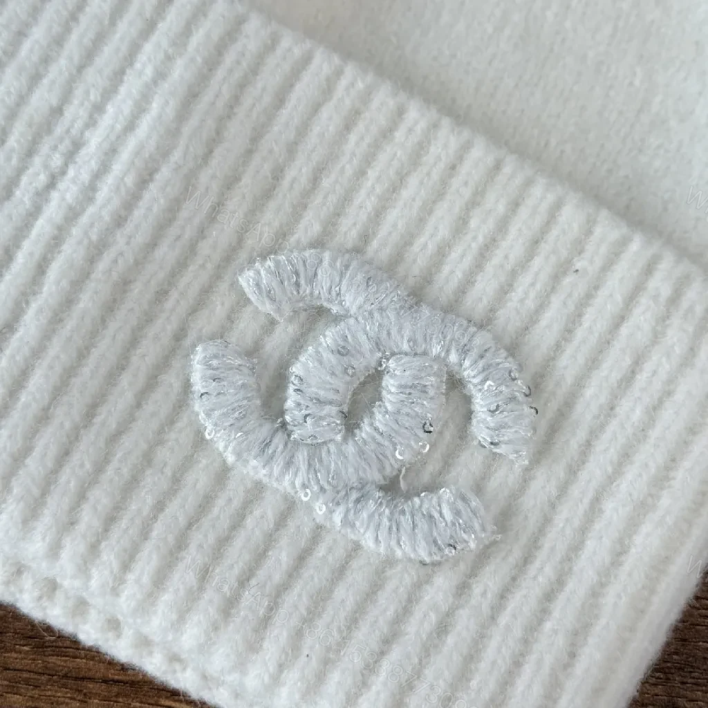 View 5 of Chic Minimalism Beanie: Off-White Knit, Embroidered Logo, Everyday Luxury