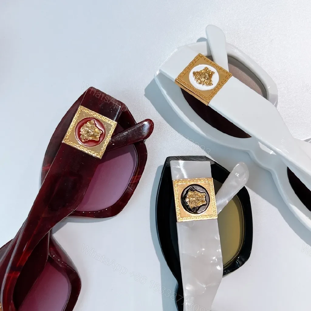 View 6 of Bold Tortoise Cat-Eye Sunglasses with Gold Medallion Accents