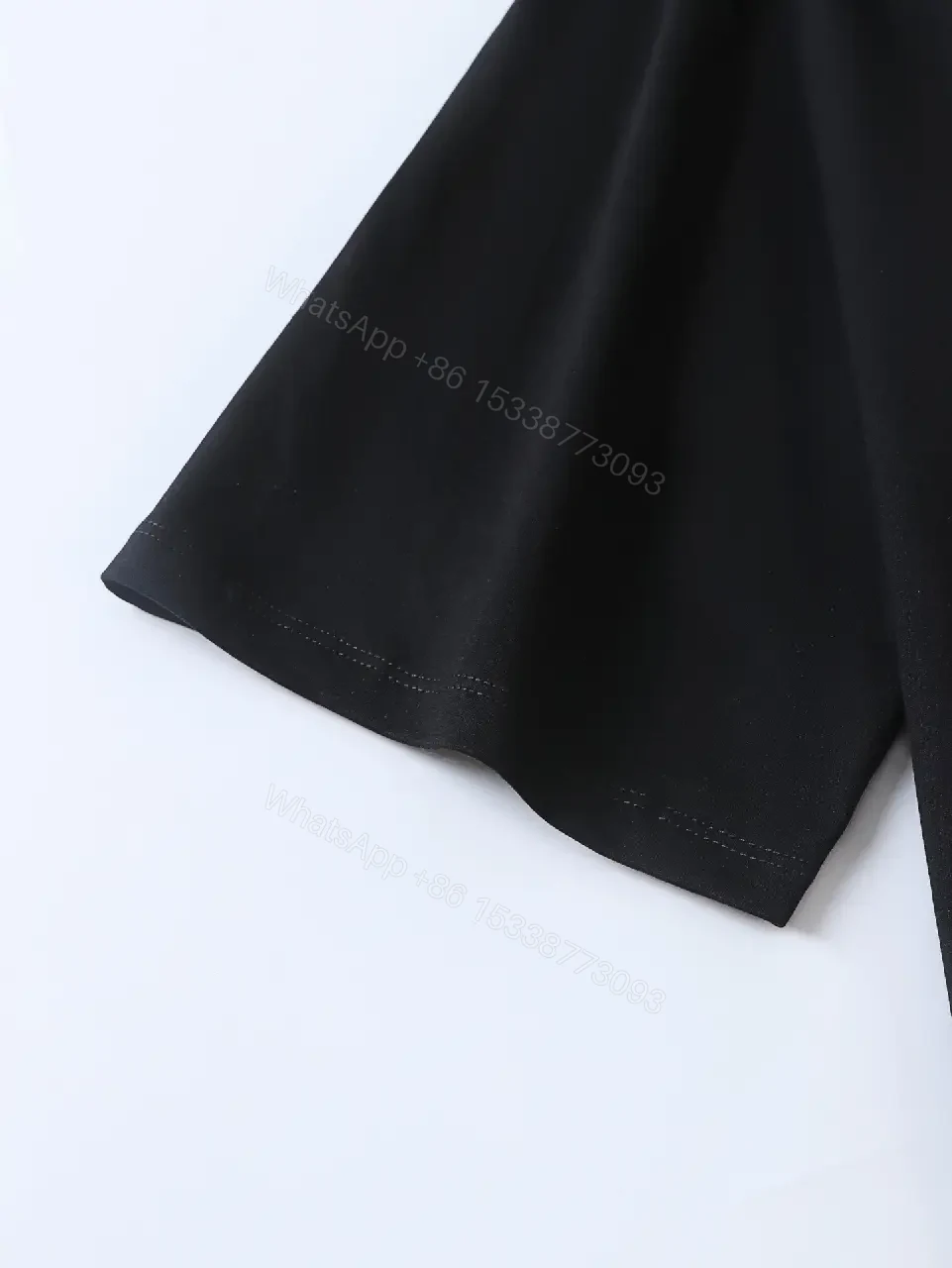 View 9 of Minimalist Black Cotton Tee: Logo-Embossed Luxury Top