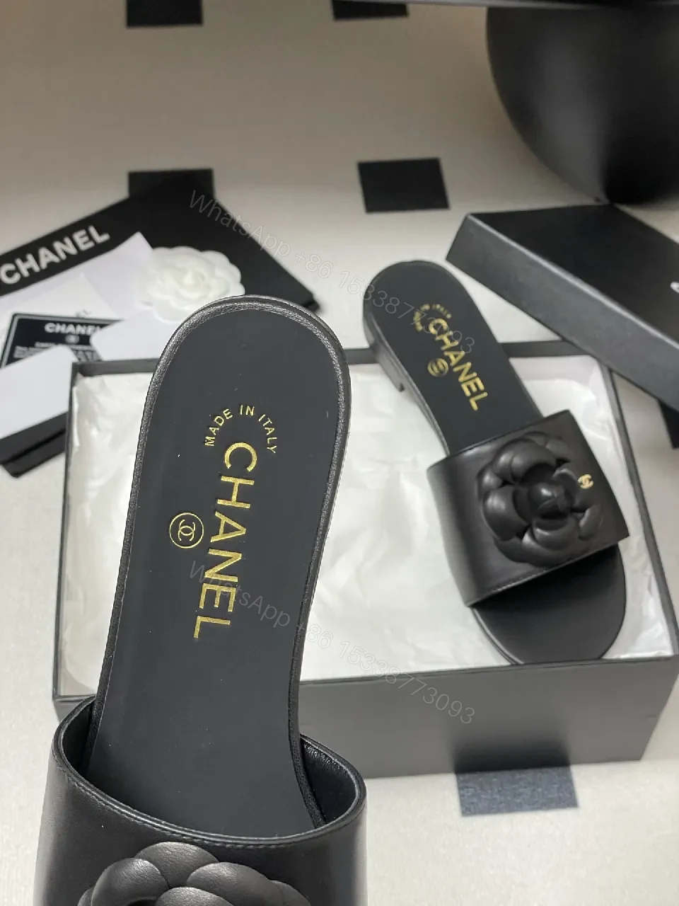 View 9 of Effortless Black Leather Slide with Camellia Detail