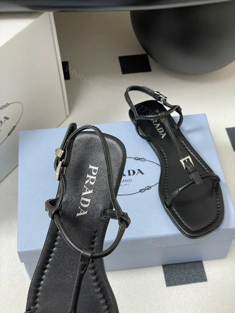 View 3 of Minimal Black Leather T-Strap Sandals with Padded Comfort
