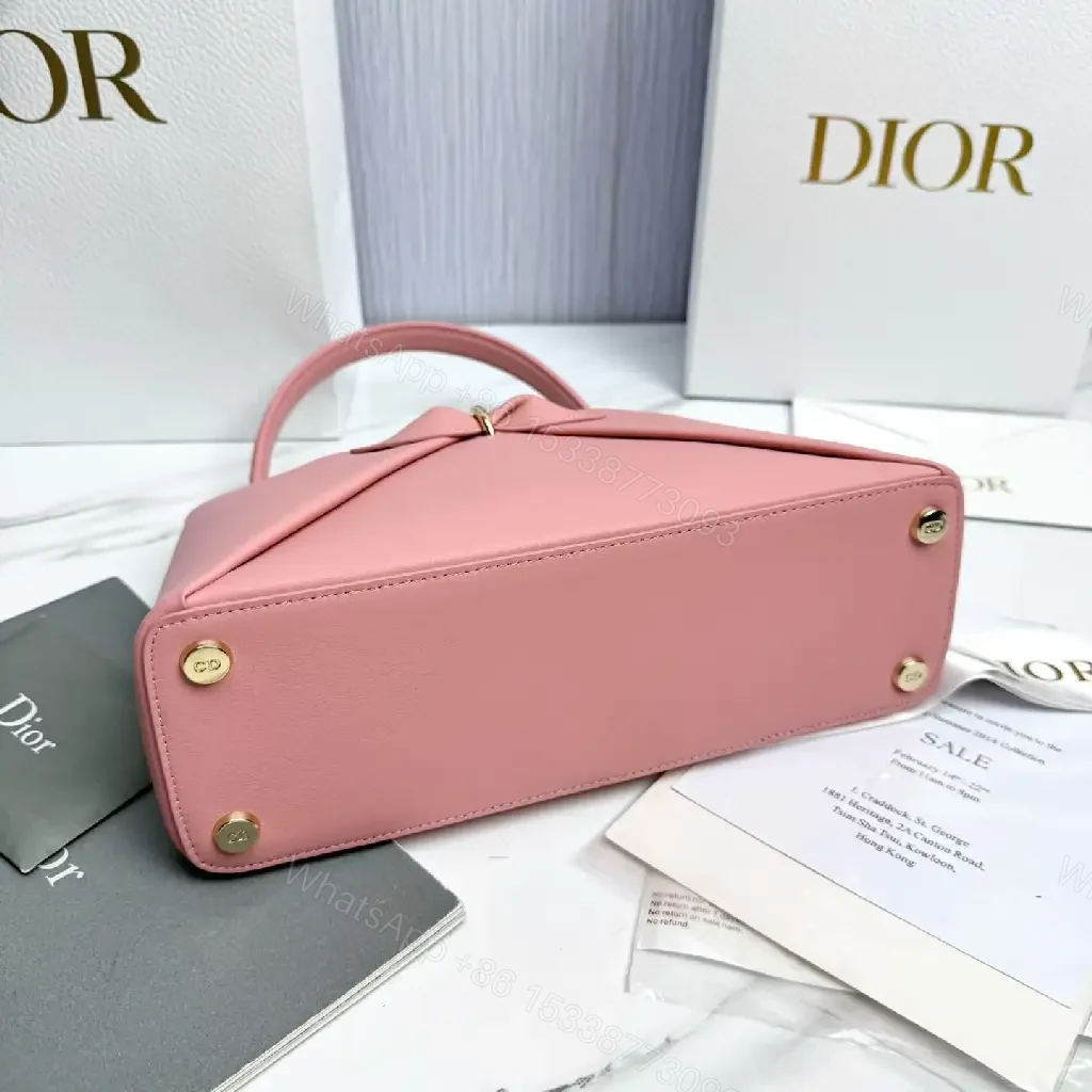 View 3 of Soft Pink Faux-Leather Satchel: Bow Accent, Sculpted Diagonal Panels, Crossbody Comfort