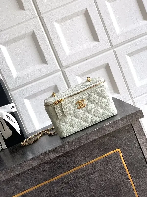 mint green quilted leather shoulder bag with gold chain and logo charm — view 1