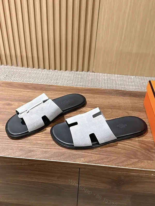 Grey suede slide sandals with cutout strap for premium everyday luxury — view 1