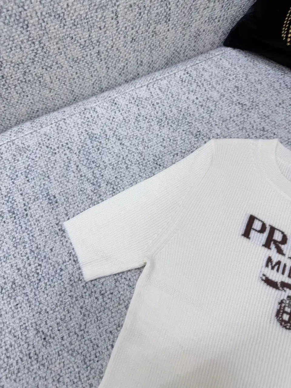 View 4 of Minimalist Ivory Knit Tee with Prominent Branding