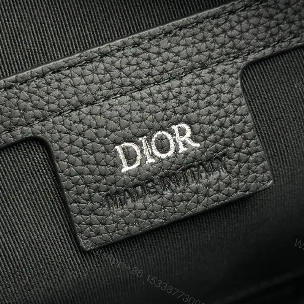 View 7 of Compact Leather Crossbody Bag - Embossed Texture, Luxury Minimalism