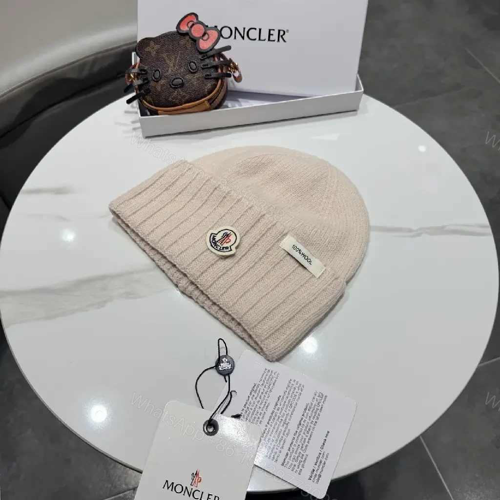 View 9 of Beige Wool Knit Beanie, Subtle Crest, Everyday Luxury