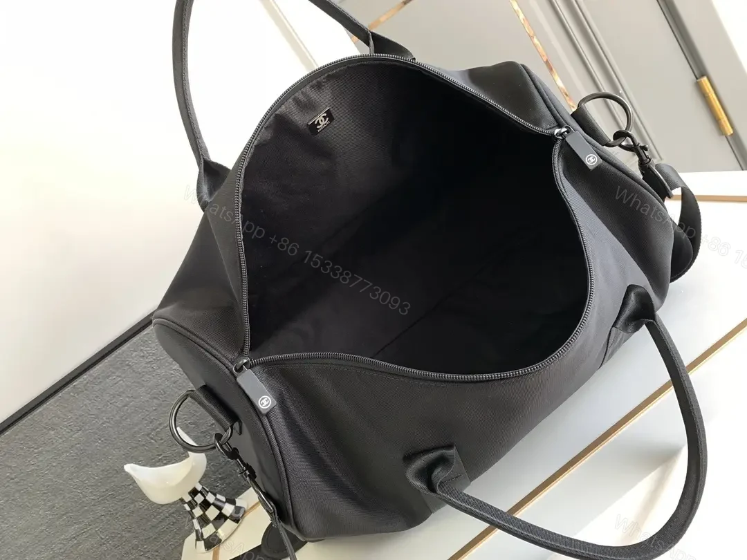 View 3 of Structured Black Travel Bag: Matte, Signature Emblem, All-Day Ready