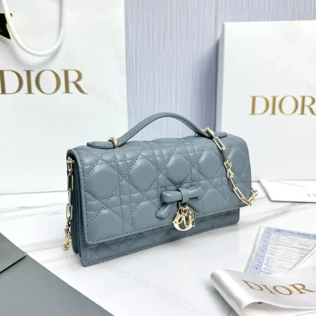 View 8 of Muted Blue-Gray Quilted Crossbody with Bow Charm, Luxe Everyday