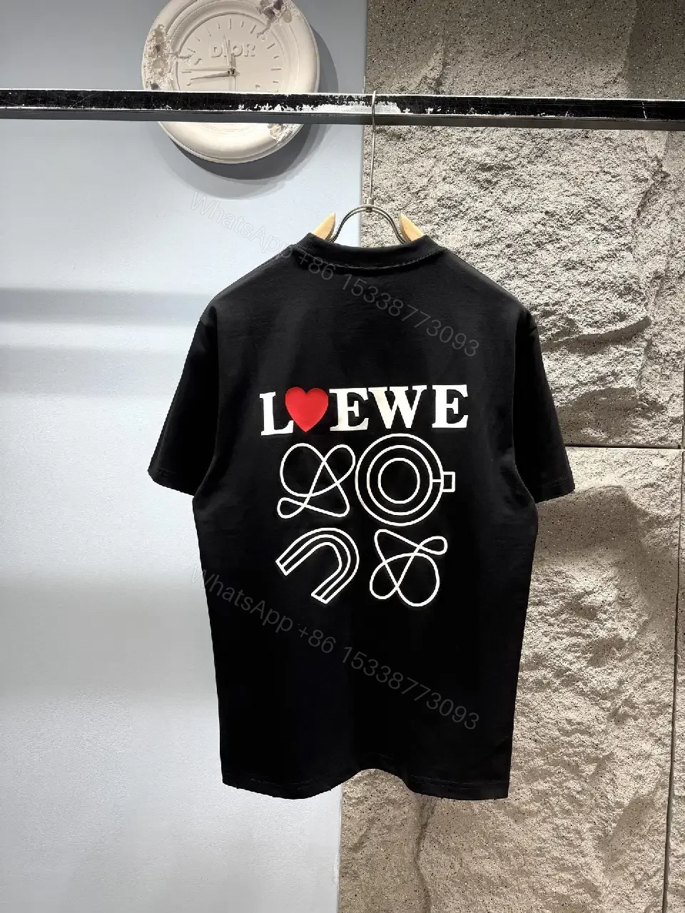 View 9 of Black Cotton Tee with Subtle Embroidered Graphic, Minimal Luxury, Everyday Wear
