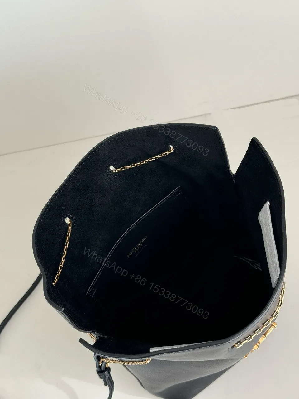 View 6 of Chic Black Leather Bucket Bag with Gold Logo