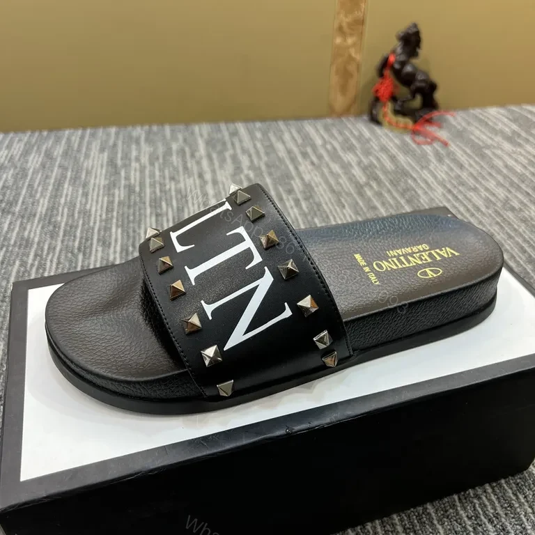 View 7 of Valentino Rockstud Leather Slides â€“ Black, Cushioned comfort