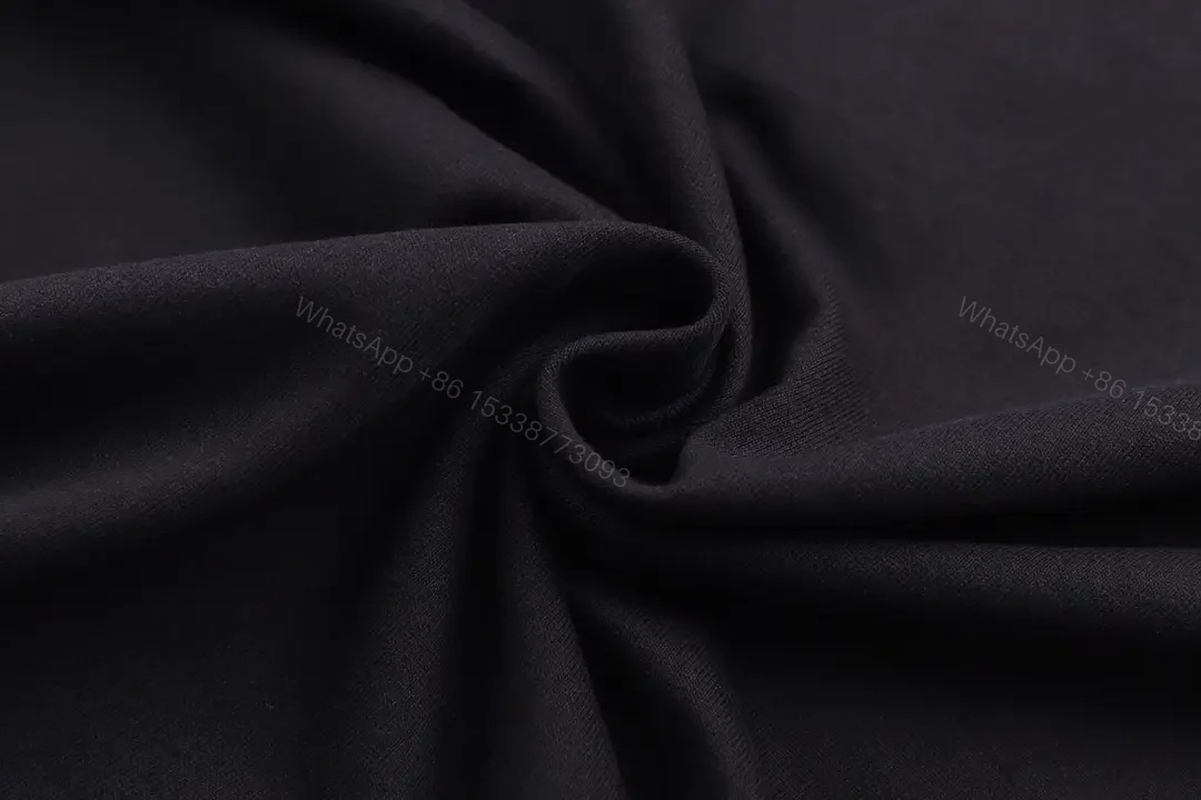 View 7 of Black Cotton Logo Tee: Subtle Crest, Everyday Luxe Top