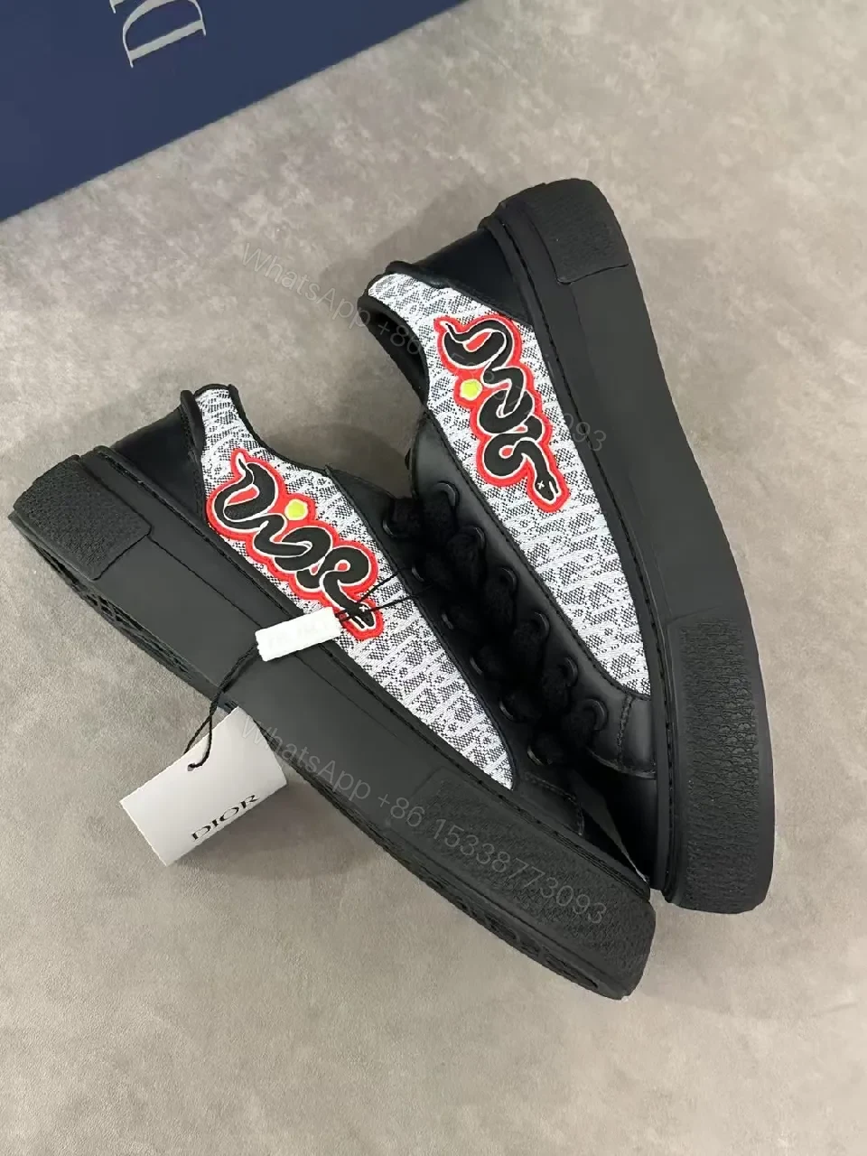 View 6 of Bold Leather High-Top Sneakers with Red Script Graphic